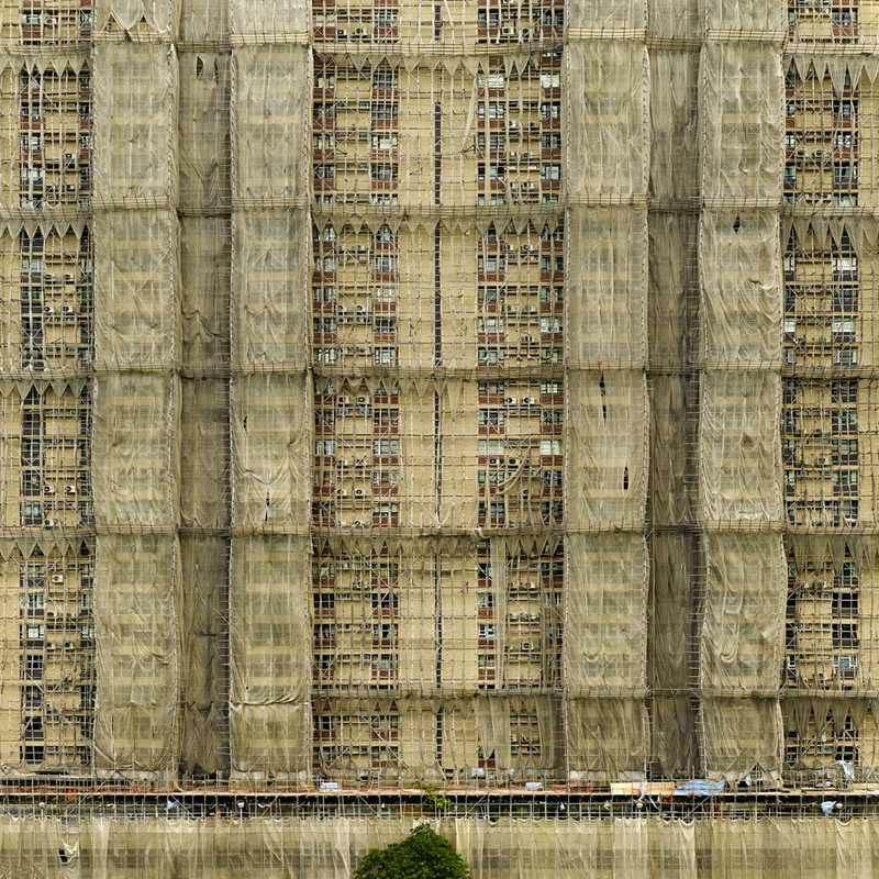 Illustration for article titled The Surreal Sight of Skyscrapers Encased in Colored Fabric